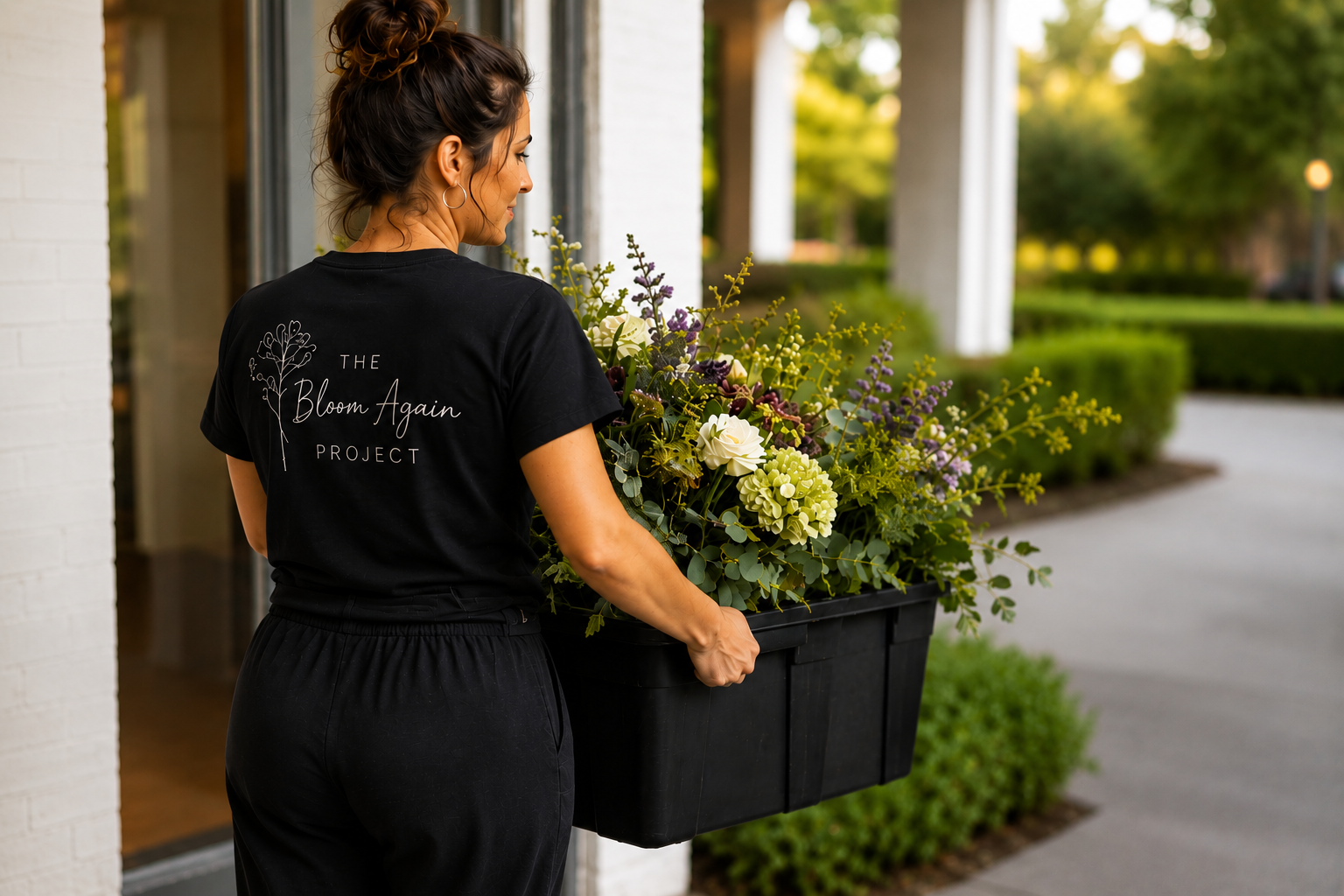 The Bloom Again Project volunteer collecting donated wedding flowers